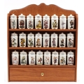 Collection of M J Hummel porcelain spice jars and covers arranged in a ...