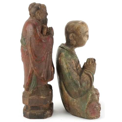 196 - Chinese polychrome painted carved wood seated Buddha and an Elder figure, the  largest 27cm high