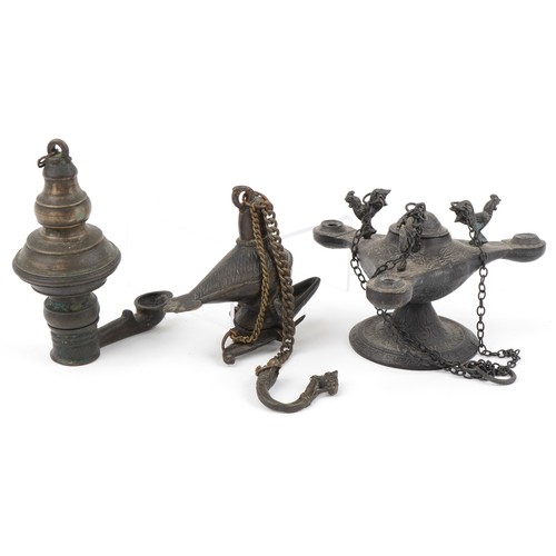 534 - Two antique Indian bronzed hanging oil lamps, one in the form of a mythical bird and a Byzantine sty... 