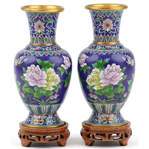 1490 - Pair of Chinese cloisonne vases raised on hardwood stands, each enamelled with butterflies amongst f... 