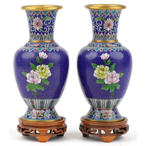 1490 - Pair of Chinese cloisonne vases raised on hardwood stands, each enamelled with butterflies amongst f... 