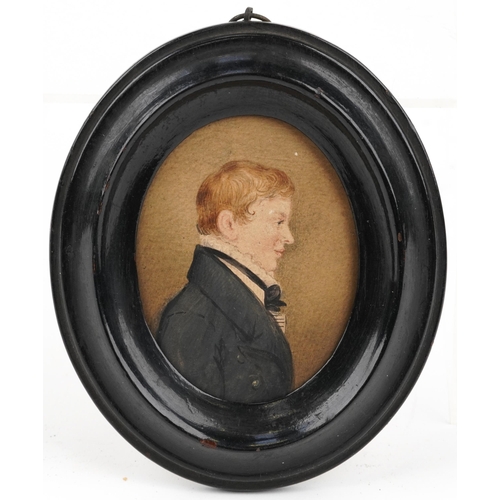 461 - Three Georgian oval hand painted portrait miniatures housed in ebonised frames, including one of an ... 