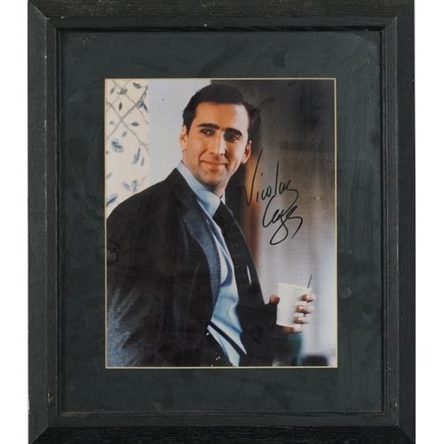 687 - Film interest coloured photograph of Nicholas Cage signed in ink with certificate of authenticity, m... 