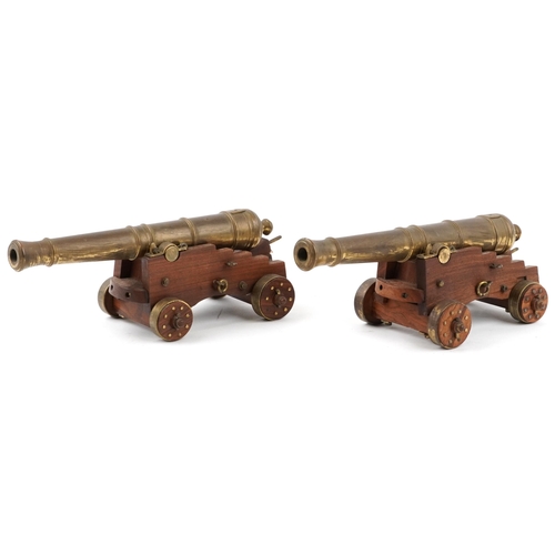 290 - Pair of mid 20th century bronze and hardwood model table cannons, each 22cm in length
PROVENANCE: Ma... 