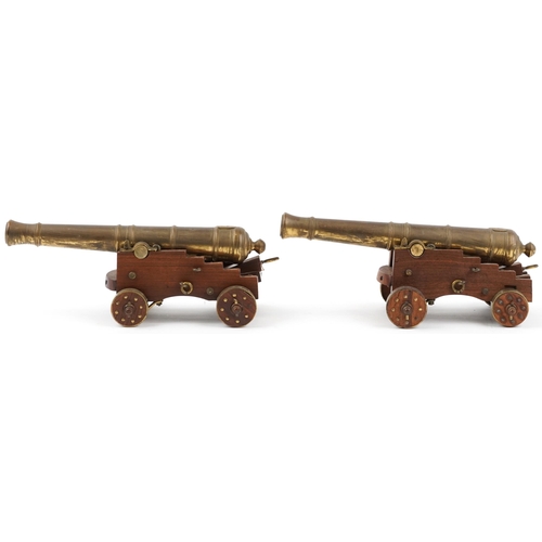 290 - Pair of mid 20th century bronze and hardwood model table cannons, each 22cm in length
PROVENANCE: Ma... 