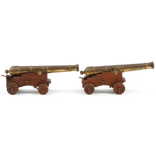 290 - Pair of mid 20th century bronze and hardwood model table cannons, each 22cm in length
PROVENANCE: Ma... 