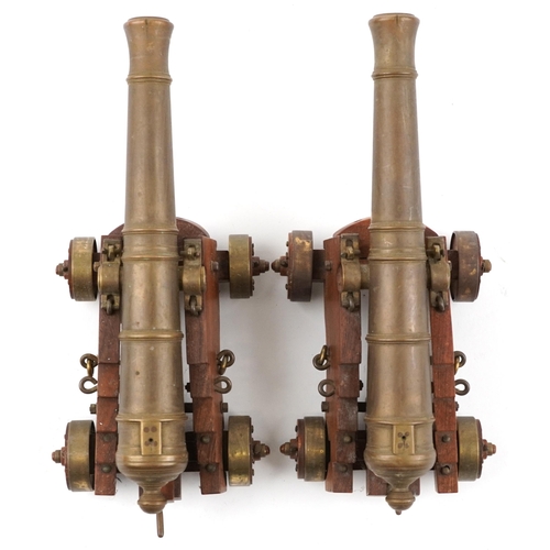 290 - Pair of mid 20th century bronze and hardwood model table cannons, each 22cm in length
PROVENANCE: Ma... 