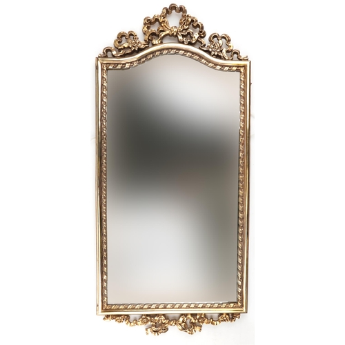 1134 - Ornate gilt framed pier mirror with bow crest, 88cm x 38.5cm