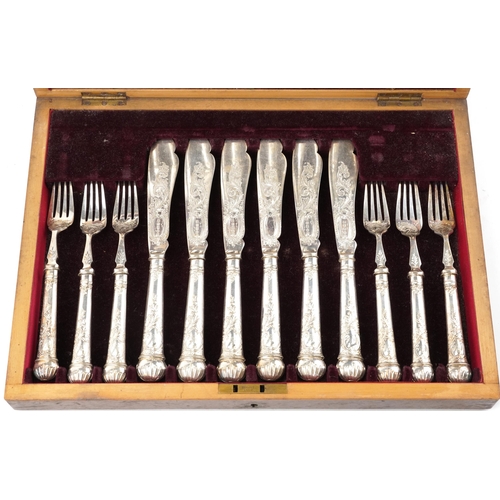 1194 - Victorian twelve place canteen of silver plated fish knives and forks engraved and embossed with flo... 