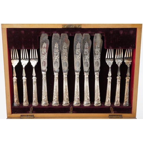 1194 - Victorian twelve place canteen of silver plated fish knives and forks engraved and embossed with flo... 