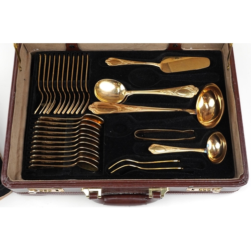 1190 - German SBS canteen of gold plated cutlery housed in a brown leather brief case, 45.5cm wide