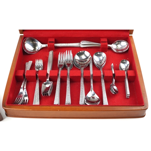 1194A - Mid century stainless steel cutlery arranged in two canteens including Viners Studio and Viners Spla... 