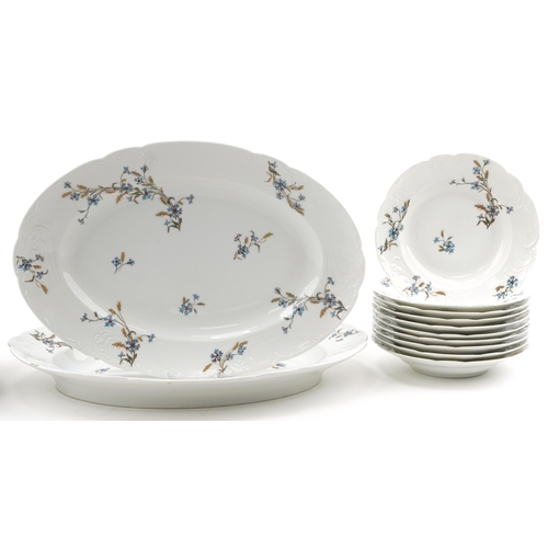 1186 - Limoges, French dinnerware including soup bowls and two oval meat platters, each decorated with flow... 