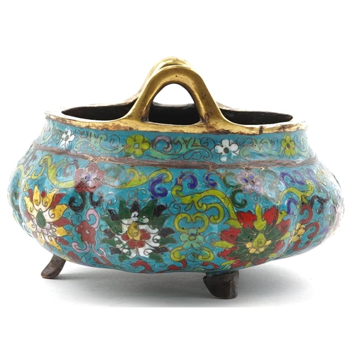 180 - Chinese patinated bronze tripod censer with twin handles enamelled with flowers amongst scrolling fo... 