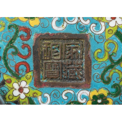 180 - Chinese patinated bronze tripod censer with twin handles enamelled with flowers amongst scrolling fo... 