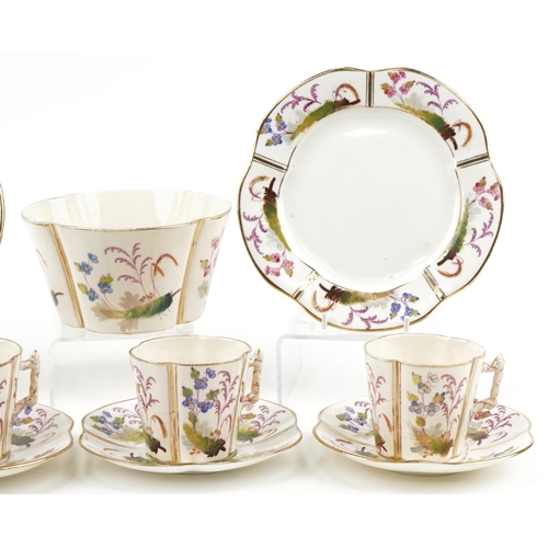 76 - Victorian teaware decorated with ferns and flowers comprising four cups, three saucers, two side pla... 