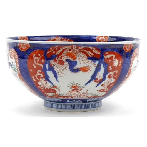 120 - Japanese Imari porcelain bowl hand painted with panels of flowers, 25cm in diameter