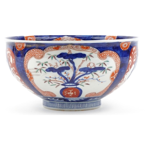 120 - Japanese Imari porcelain bowl hand painted with panels of flowers, 25cm in diameter