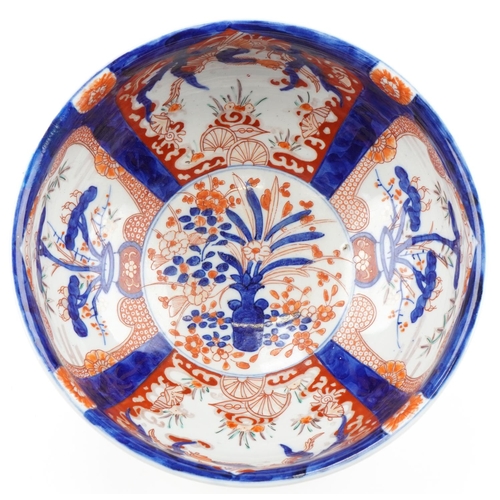 120 - Japanese Imari porcelain bowl hand painted with panels of flowers, 25cm in diameter