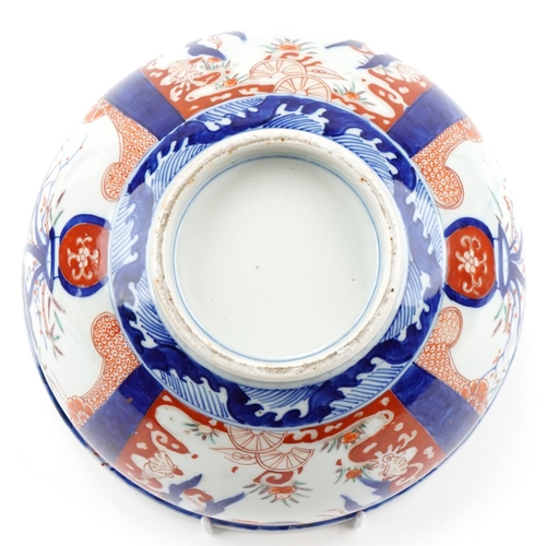 120 - Japanese Imari porcelain bowl hand painted with panels of flowers, 25cm in diameter