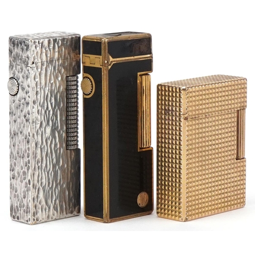 39 - Three vintage pocket lighters, gold plated S J Dupont, silver plated Dunhill bark design and gold pl... 