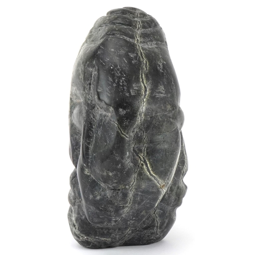 541 - Large natural history and geology interest serpentine specimen carved with three faces, 20cm high