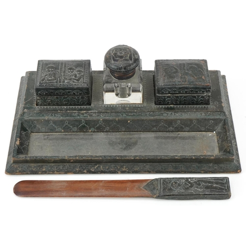 477 - 19th century European leather desk stand with two boxes, inkwell and letter opener embossed with fig... 