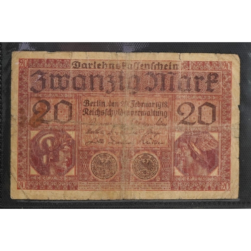 569 - World banknotes arranged in an album including Bank of Scotland twenty pounds, Kenya, Indonesia and ... 