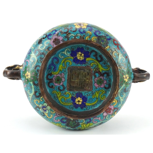 181 - Chinese patinated bronze and cloisonne censer with elephant head handles enamelled with flowers amon... 