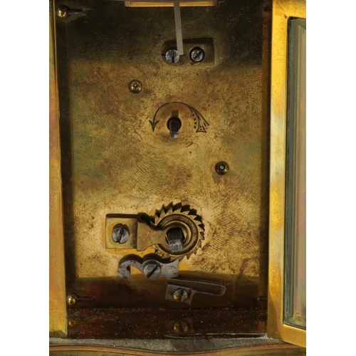 422 - French brass serpentine fronted carriage clock with enamelled dial together with another brass carri... 