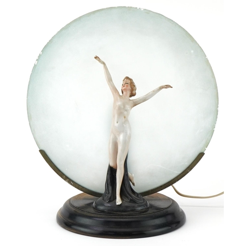 236 - Art Deco porcelain table lamp of a nude female mounted on a wooden base with frosted glass shade, 30... 