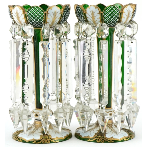 82 - Pair of Victorian overlaid green glass lustres hand painted with leaves, having clear glass drops, e... 