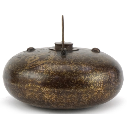 1300 - Chinese bronzed metal flask decorated with script and flowers, 20cm in diameter