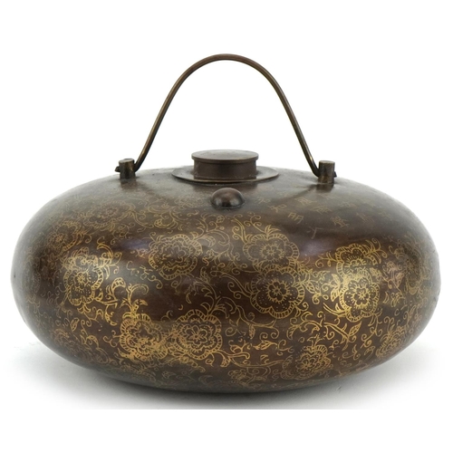 1300 - Chinese bronzed metal flask decorated with script and flowers, 20cm in diameter