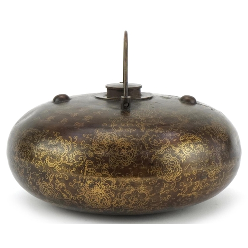 1300 - Chinese bronzed metal flask decorated with script and flowers, 20cm in diameter