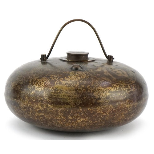 1300 - Chinese bronzed metal flask decorated with script and flowers, 20cm in diameter