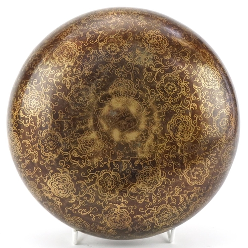 1300 - Chinese bronzed metal flask decorated with script and flowers, 20cm in diameter