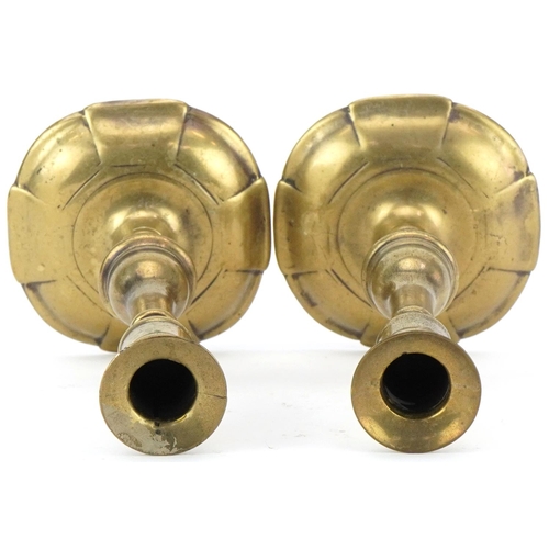 298 - Pair of Georgian brass petal based candlesticks, 19cm high