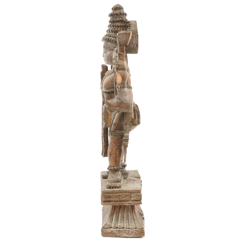 522 - Large wooden carved Balinese figure of a god, 55cm high