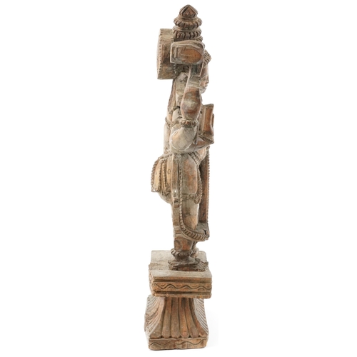 522 - Large wooden carved Balinese figure of a god, 55cm high