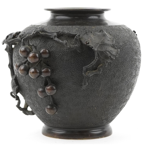 121 - Japanese bronze vase relief moulded with grapes and vines, impressed signature to the base, 23cm hig... 