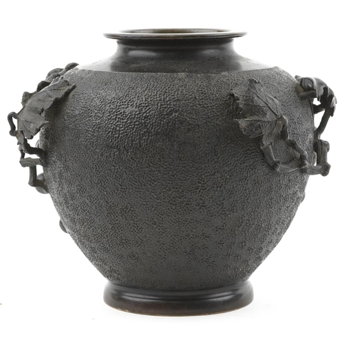 121 - Japanese bronze vase relief moulded with grapes and vines, impressed signature to the base, 23cm hig... 