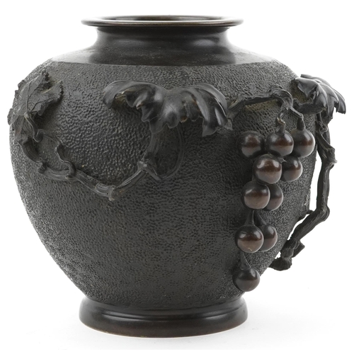 121 - Japanese bronze vase relief moulded with grapes and vines, impressed signature to the base, 23cm hig... 