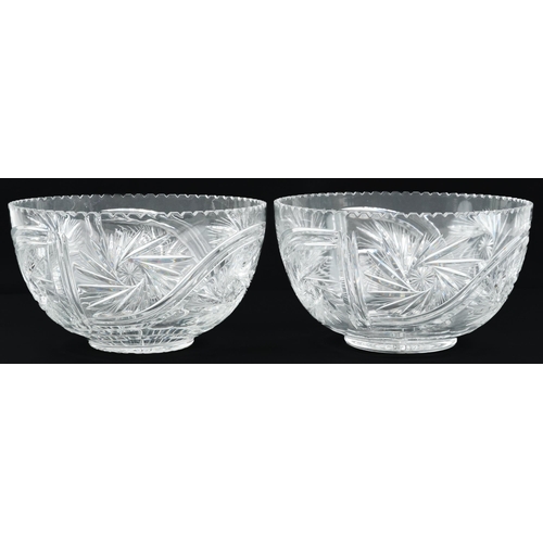 84 - Large pair of good quality glass bowls cut with wheel design and star bases, each 29cm in diameter