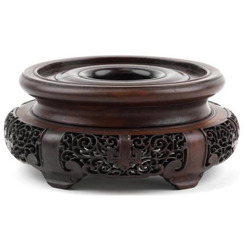 195 - Chinese carved and pierced hardwood stand, 20cm in diameter