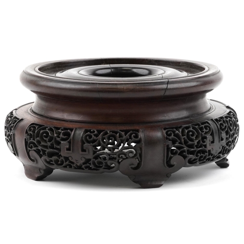 195 - Chinese carved and pierced hardwood stand, 20cm in diameter