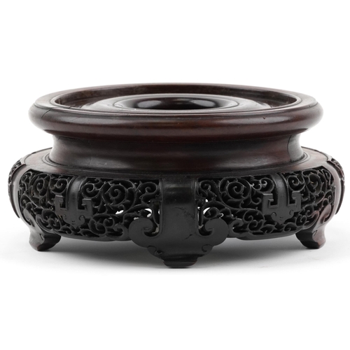 195 - Chinese carved and pierced hardwood stand, 20cm in diameter