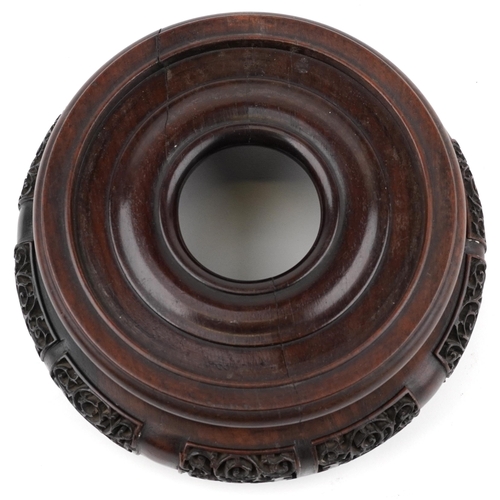 195 - Chinese carved and pierced hardwood stand, 20cm in diameter