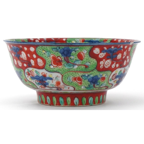 218 - 18th Century Chinese blue and white bowl overpainted with iron red and green, decorated with flowers... 