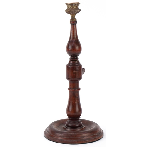 317 - Victorian mahogany and brass rise and fall candlestick with brass sconce, 31cm when closed